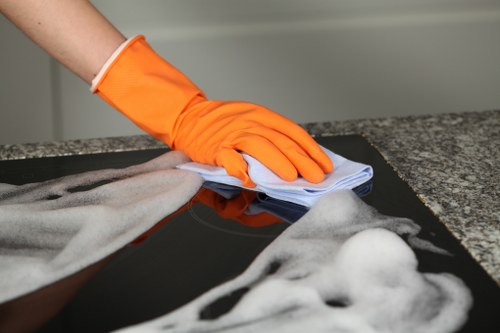 Carpet cleaning technician preparing equipment in a safe working environment