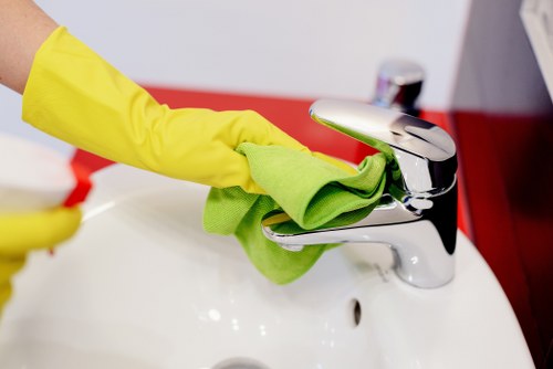 Carpet cleaning technician preparing equipment in a safe home environment