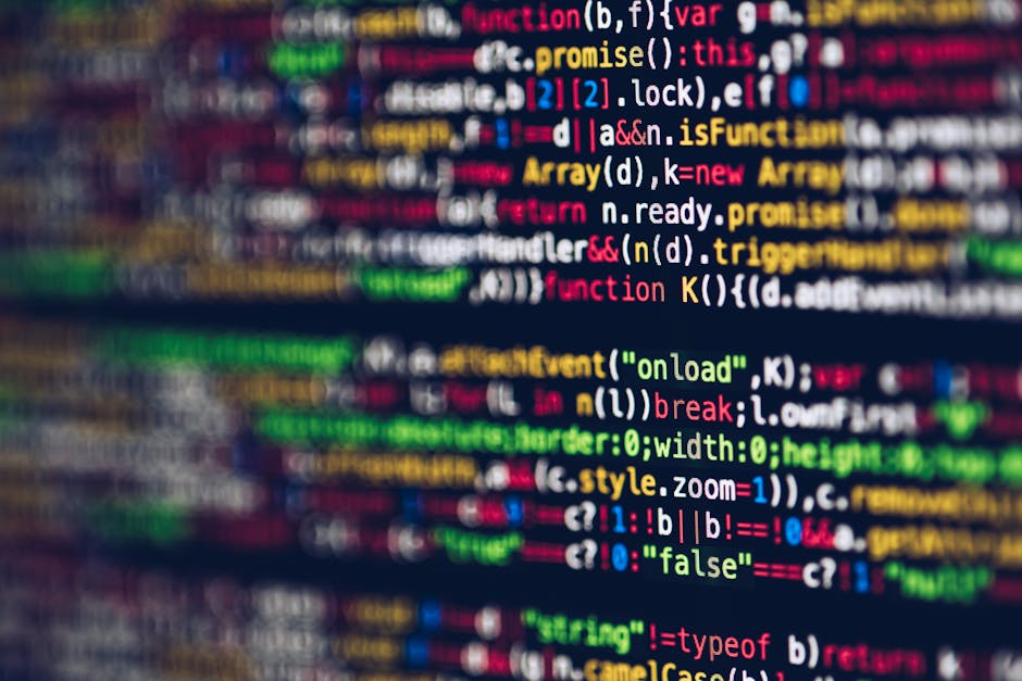 Close-up view of a computer screen displaying colorful lines of code in various programming languages, including keywords, variables, and functions, with a blurred background and no visible hardware o
